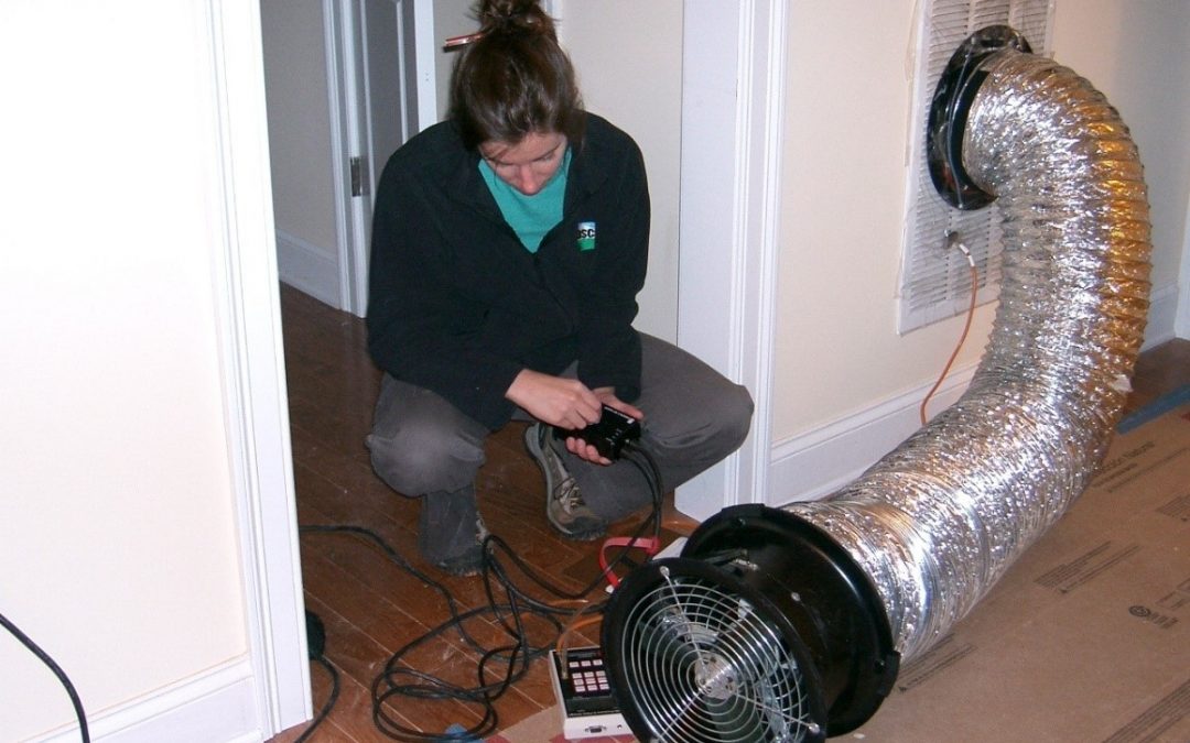 person conducting energy code duct leakage test